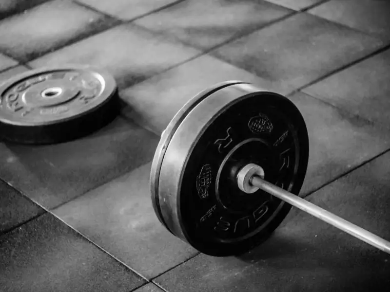 Barbell resting on the floor